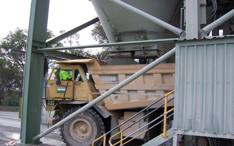 Dump Truck under Silo Chute filling