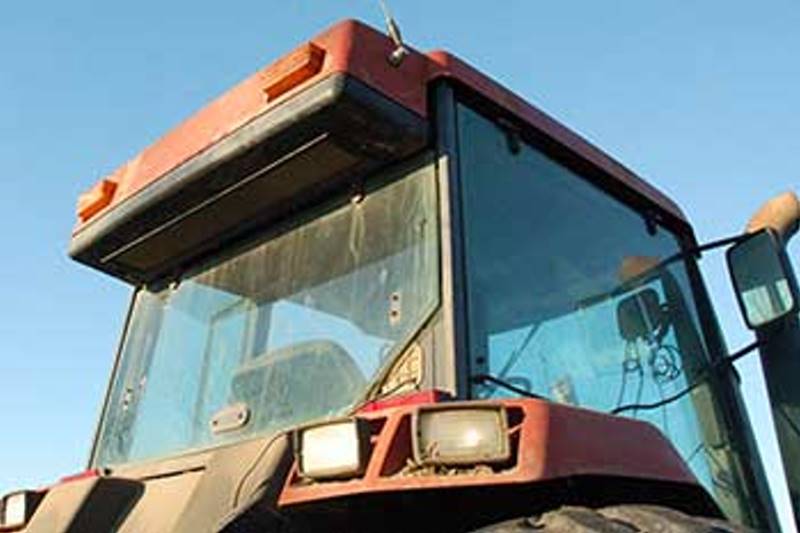The air intake is located at the rear of the cab roof, behind the operator's head. It sucks in airborne chaff, pesticides, and fertilizer stirred up behind the tractor. The filter was blown out after every three hours of operation. Each blow-out enlarges the pores of the filter, making it less and less effective